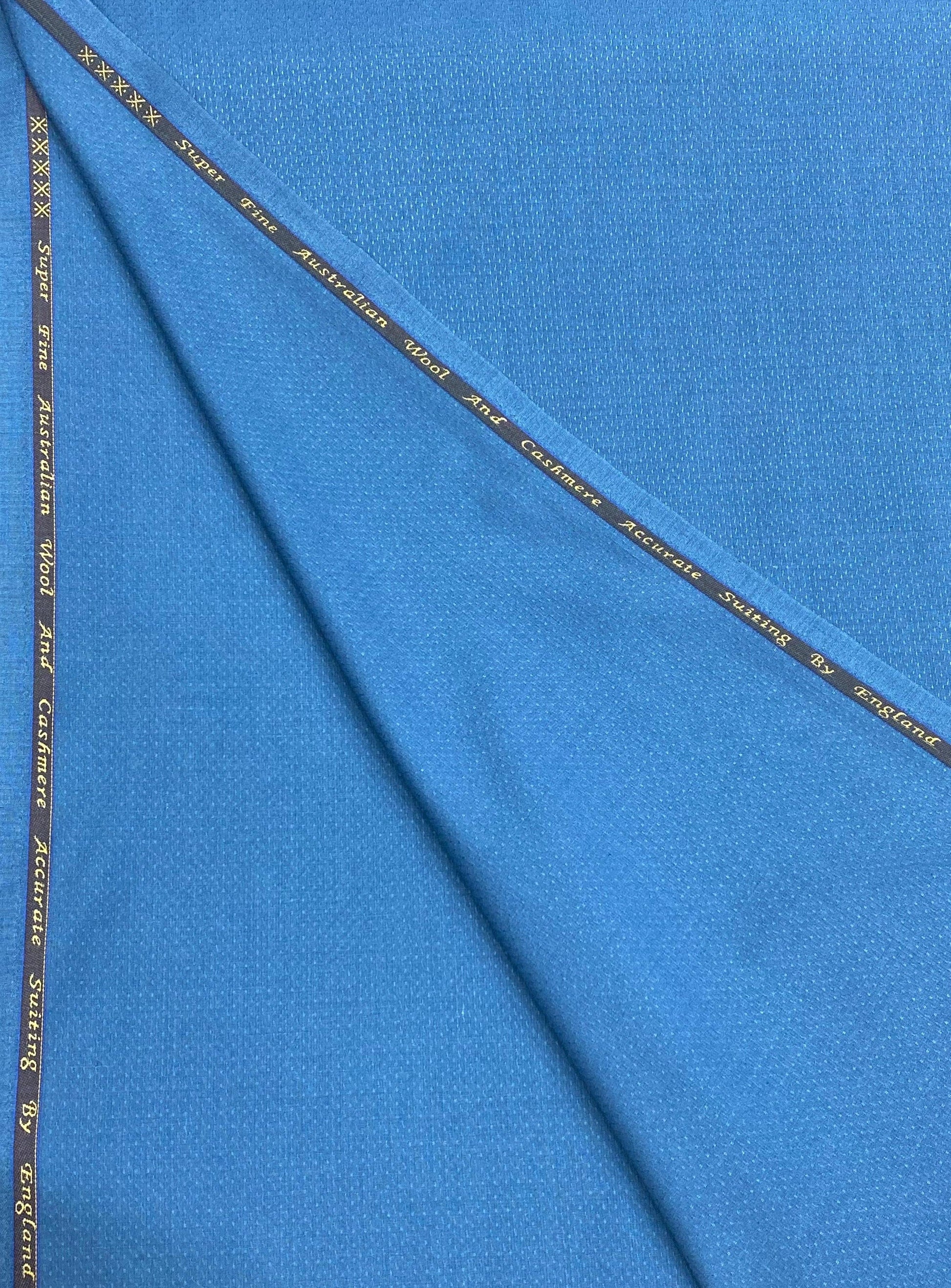 Blue fabric with a thin black stripe running diagonally across it.